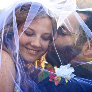 under veil wedding couple